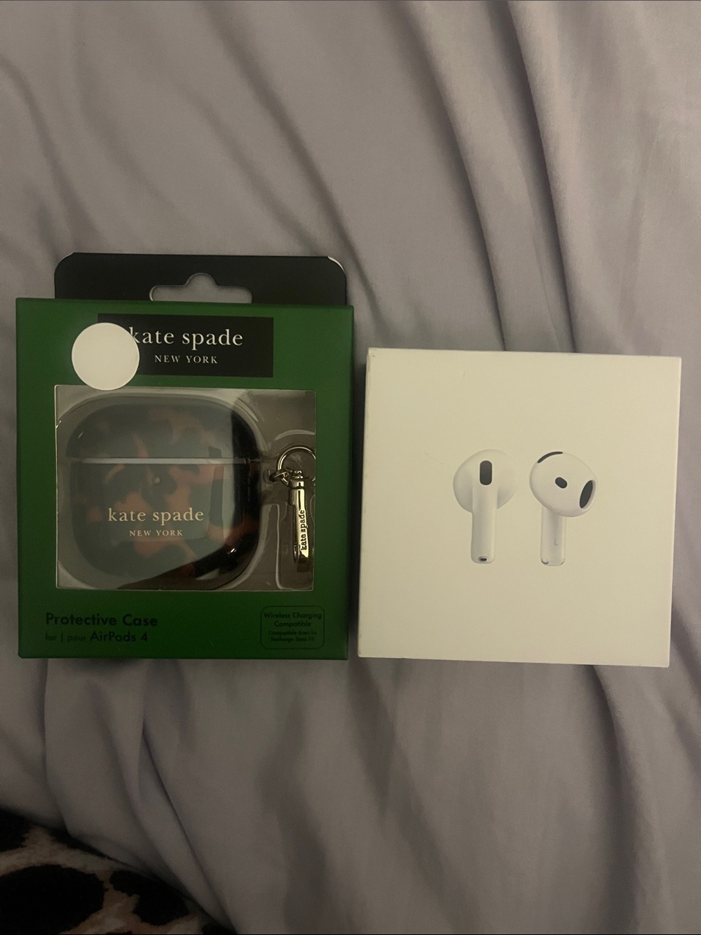 AirPods 4 with protective case